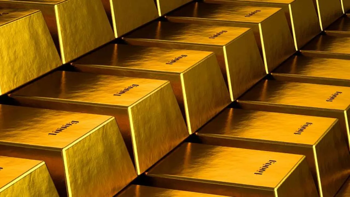 Altın külçeleri ve borsa ekranı